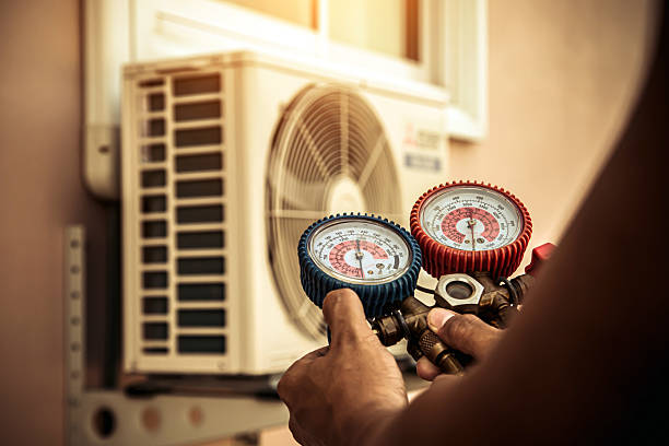 Professional Air Conditioning Service technician working in Candia, NH